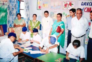 Judging Drawing Competition at DAV Charnarthal