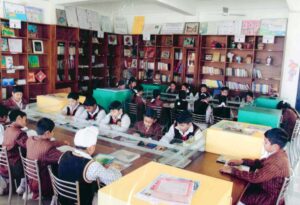 Students enhancing their reading skills in School Library