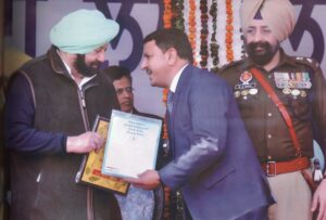 Receiving the State Level Best Educationist Award from Ex Chief Minister of Punjab